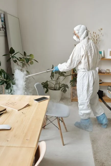 Cleaner cleaning the floor in a laboratory environment